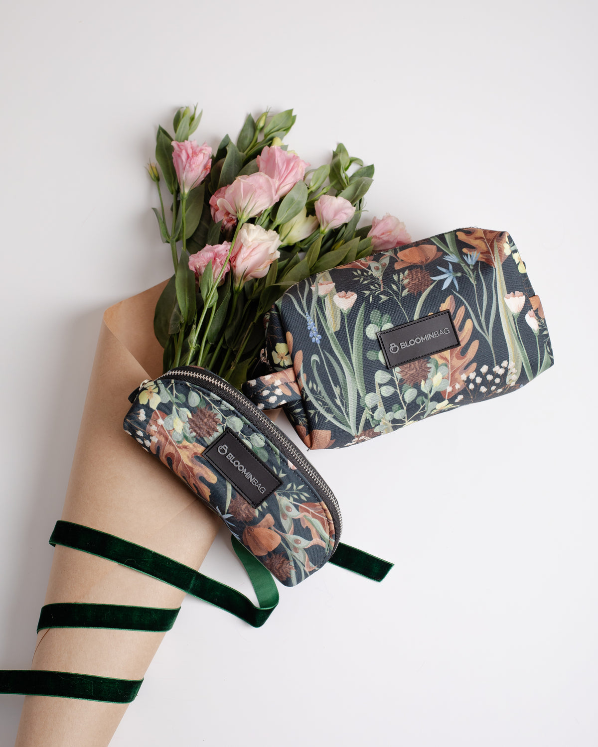 Floral-patterned pouches with a bouquet of flowers on a white background